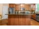 Spacious kitchen island with granite countertops and stainless-steel appliances at 4616 Town Manor Dr, Douglasville, GA 30135