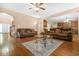 Inviting living room features hardwood floors, a ceiling fan, and comfortable leather sofas at 4616 Town Manor Dr, Douglasville, GA 30135