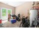 Utility storage room with double doors that offers easy access to outdoor spaces at 4616 Town Manor Dr, Douglasville, GA 30135