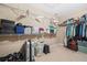 Walk-in closet with wire shelving for storage of clothing and suitcases at 4616 Town Manor Dr, Douglasville, GA 30135