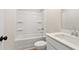 Bathroom featuring a bathtub with shower, toilet, and vanity with sink at 4667 Larkfield Way, Powder Springs, GA 30127