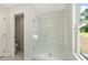 Modern bathroom featuring a glass enclosed shower, and neutral tile at 4667 Larkfield Way, Powder Springs, GA 30127