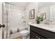 Well-lit bathroom featuring a tub-shower combo, modern vanity, and contemporary decor at 4667 Larkfield Way, Powder Springs, GA 30127