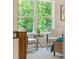 Inviting bedroom nook with large windows showcasing a beautiful view of the surrounding trees at 4667 Larkfield Way, Powder Springs, GA 30127