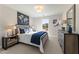 Well-lit bedroom with a queen bed, plush carpet, and neutral tones creating a calming atmosphere at 4667 Larkfield Way, Powder Springs, GA 30127