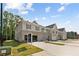 New multi-Gathering construction with brick and siding, professional landscaping, and an open parking area at 4667 Larkfield Way, Powder Springs, GA 30127