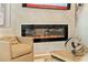 Modern electric fireplace with a tiled surround at 4667 Larkfield Way, Powder Springs, GA 30127