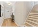 Inviting foyer with light wood floors, white trim, and staircase leading to the upper level at 4667 Larkfield Way, Powder Springs, GA 30127
