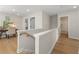Bright hallway featuring hardwood floors, and a desk area with natural light for a versatile living space at 4667 Larkfield Way, Powder Springs, GA 30127