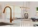 Close up of a kitchen island and a gold faucet at 4667 Larkfield Way, Powder Springs, GA 30127