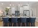Stylish kitchen island with quartz countertops, seating for four, and pendant lighting at 4667 Larkfield Way, Powder Springs, GA 30127