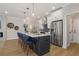 Beautiful kitchen featuring a large center island with seating, stainless steel appliances, and modern cabinetry at 4667 Larkfield Way, Powder Springs, GA 30127