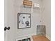 Cozy laundry area with a storage shelf, basket, and stylish wall art at 4667 Larkfield Way, Powder Springs, GA 30127