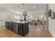 Open-concept living space showcasing a large kitchen island, modern finishes, and abundant natural light at 4667 Larkfield Way, Powder Springs, GA 30127