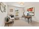 Well-lit home office with a desk and comfortable seating at 4667 Larkfield Way, Powder Springs, GA 30127