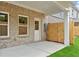 Outdoor patio area with brick exterior and a newly constructed wooden privacy fence at 4667 Larkfield Way, Powder Springs, GA 30127