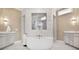 Luxurious bathroom featuring a freestanding tub, dual vanities, and a spacious shower with decorative tiling at 5335 Briarstone Ridge Way, Alpharetta, GA 30022