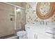 Well-appointed bathroom features tile floors, quartz countertop and a tiled shower at 5335 Briarstone Ridge Way, Alpharetta, GA 30022