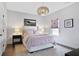 Comfortable bedroom features a plush bed, modern lighting, and stylish decor for a peaceful retreat at 5335 Briarstone Ridge Way, Alpharetta, GA 30022