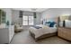 Serene bedroom with large window, comfortable bed, and designer furnishings for ultimate relaxation at 5335 Briarstone Ridge Way, Alpharetta, GA 30022