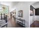 Elegant foyer featuring hardwood floors, staircase, and an adjacent living area with ample natural light at 5335 Briarstone Ridge Way, Alpharetta, GA 30022