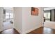 Hallway view showcases hardwood floors and glimpses into adjacent rooms, creating an inviting atmosphere at 5335 Briarstone Ridge Way, Alpharetta, GA 30022