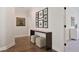 Inviting hallway features hardwood floors and stylish decor, leading to other parts of the home at 5335 Briarstone Ridge Way, Alpharetta, GA 30022