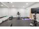 Home gym features mirrored wall, rubber floor and a variety of workout equipment at 5335 Briarstone Ridge Way, Alpharetta, GA 30022
