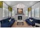 Cozy living room featuring a fireplace, plush seating, and abundant natural light at 5335 Briarstone Ridge Way, Alpharetta, GA 30022