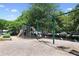 Community playground with slides, swings, and climbing structures, set in a park-like setting at 5335 Briarstone Ridge Way, Alpharetta, GA 30022
