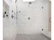 Modern walk-in shower featuring sleek fixtures, marble tile, and a frameless glass door for a clean, contemporary look at 5335 Briarstone Ridge Way, Alpharetta, GA 30022