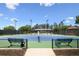 Well-maintained community tennis courts with lighting, seating, and green and blue surface at 5335 Briarstone Ridge Way, Alpharetta, GA 30022