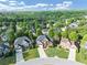 Serene aerial view showcasing the home nestled in a lush, green neighborhood with tree-lined streets at 566 Vintage Pointe Run, Mableton, GA 30126