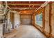Unfinished basement, insulated and ready for customization, featuring utility connections and a window for natural light at 566 Vintage Pointe Run, Mableton, GA 30126