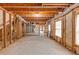 Spacious unfinished basement with exposed beams and a blank canvas for your dream recreation or entertainment area at 566 Vintage Pointe Run, Mableton, GA 30126