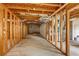 Unfinished basement featuring exposed ceiling and concrete walls, perfect for customizing to your needs and preferences at 566 Vintage Pointe Run, Mableton, GA 30126