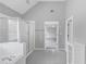 Bathroom featuring soaking tub and glass enclosed shower at 566 Vintage Pointe Run, Mableton, GA 30126