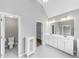 Bathroom featuring double vanity, toilet, and storage at 566 Vintage Pointe Run, Mableton, GA 30126