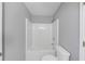 Bathroom featuring neutral walls, toilet and a tub with shower at 566 Vintage Pointe Run, Mableton, GA 30126