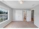 Bedroom featuring neutral walls and carpet, a window, and access to a bathroom at 566 Vintage Pointe Run, Mableton, GA 30126
