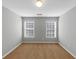 Bedroom featuring neutral walls and carpet and two windows with blinds at 566 Vintage Pointe Run, Mableton, GA 30126