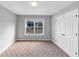 Bedroom featuring neutral walls and carpet, a window, and double door closet at 566 Vintage Pointe Run, Mableton, GA 30126
