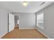 Bedroom featuring neutral walls and carpet, a window, and access to a walk-in closet at 566 Vintage Pointe Run, Mableton, GA 30126