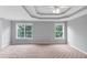 Spacious bedroom bathed in natural light from large windows with neutral carpet at 566 Vintage Pointe Run, Mableton, GA 30126