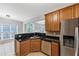 Cozy kitchen with granite counters, stainless steel appliances, and access to living area at 566 Vintage Pointe Run, Mableton, GA 30126
