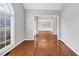 Spacious living room with hardwood floors, neutral paint, and views to the dining room at 566 Vintage Pointe Run, Mableton, GA 30126
