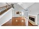 Open floor plan with hardwood floors, fireplace, and access to the kitchen at 566 Vintage Pointe Run, Mableton, GA 30126