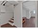 Basement area with wood-look flooring, stairs, and neutral colored walls at 1520 Oxford St, Douglasville, GA 30134