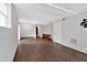 Large basement area with neutral walls and wood-look flooring throughout at 1520 Oxford St, Douglasville, GA 30134