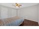 Neutral bedroom showcases ceiling fan and hardwood floors at 1520 Oxford St, Douglasville, GA 30134